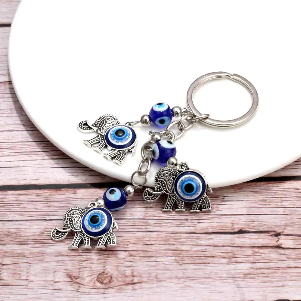 Breloc 3 elefanți cu trompa în sus si ochi albastru norocos
