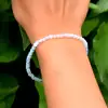 Bratara cuart Opal sau piatra lunii, cca 47 pietricele mici 4 mm alb-albastru