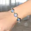 Bratara 7 pietre Opal, piatra rotunda alb albastru, incuietoare toggle reglabila
