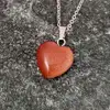 Pandantiv Piatra Soarelui, piatra personalității și a norocului, cristal natural în formă de inimă maro 2 cm