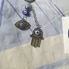 Breloc Hamsa și Ochiul norocos, amuletă feng