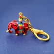 Breloc amuleta anti conflict, elefant roșu al prosperității și vasul păcii, metal solid