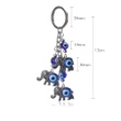Breloc 3 elefanți cu trompa în sus si ochiul magic norocos albastru, amuletă feng shui de protecție și noroc, metal solid argintiu 11 cm