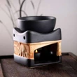 Lampa aromaterapie elefant cu trompa in sus, vas uleiuri esentiale si lumanari, gama profesionala HEM ceramica negru si crem, 8 cm