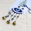 Clopotei de vant cu ochiul norocos albastru, simbol al norocului si al inteligentei